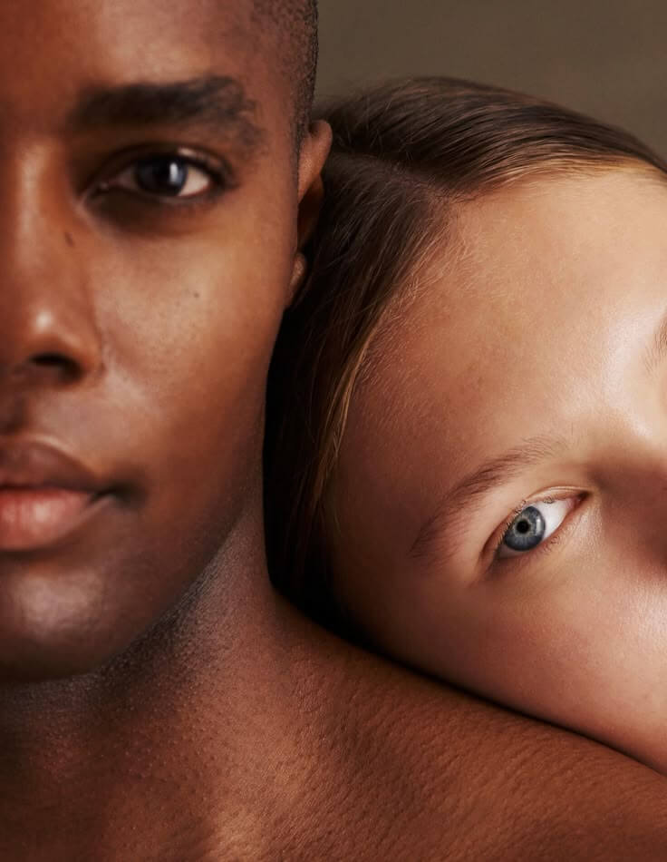Close-up of two individuals with different skin tones side by side, highlighting inclusive beauty and skincare diversity, IMEAN Beauty brand.