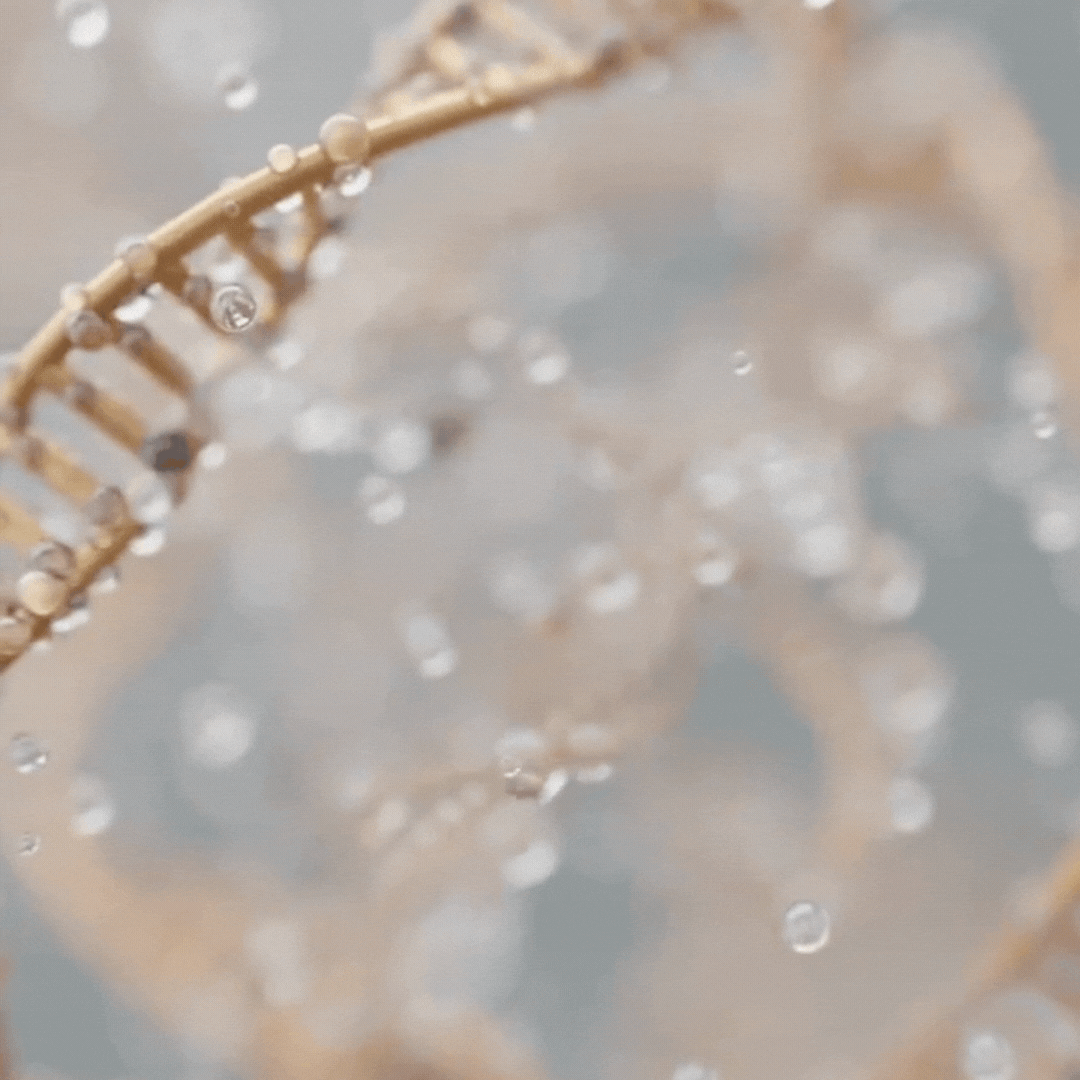 Soft-focus water bokeh background in motion, evoking hydration.