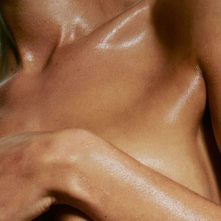 Close-up of a person's shoulder and neck with a soft focus